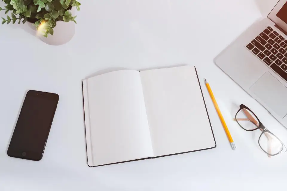 Desk with notebook (stock photo)